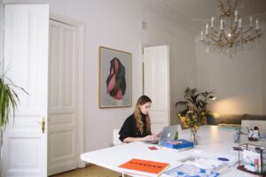 a woman working from home in her dining room