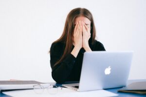 a woman stressed out while working.